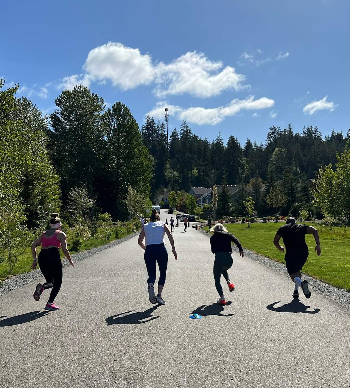 Outdoor fitness class with dumbbells