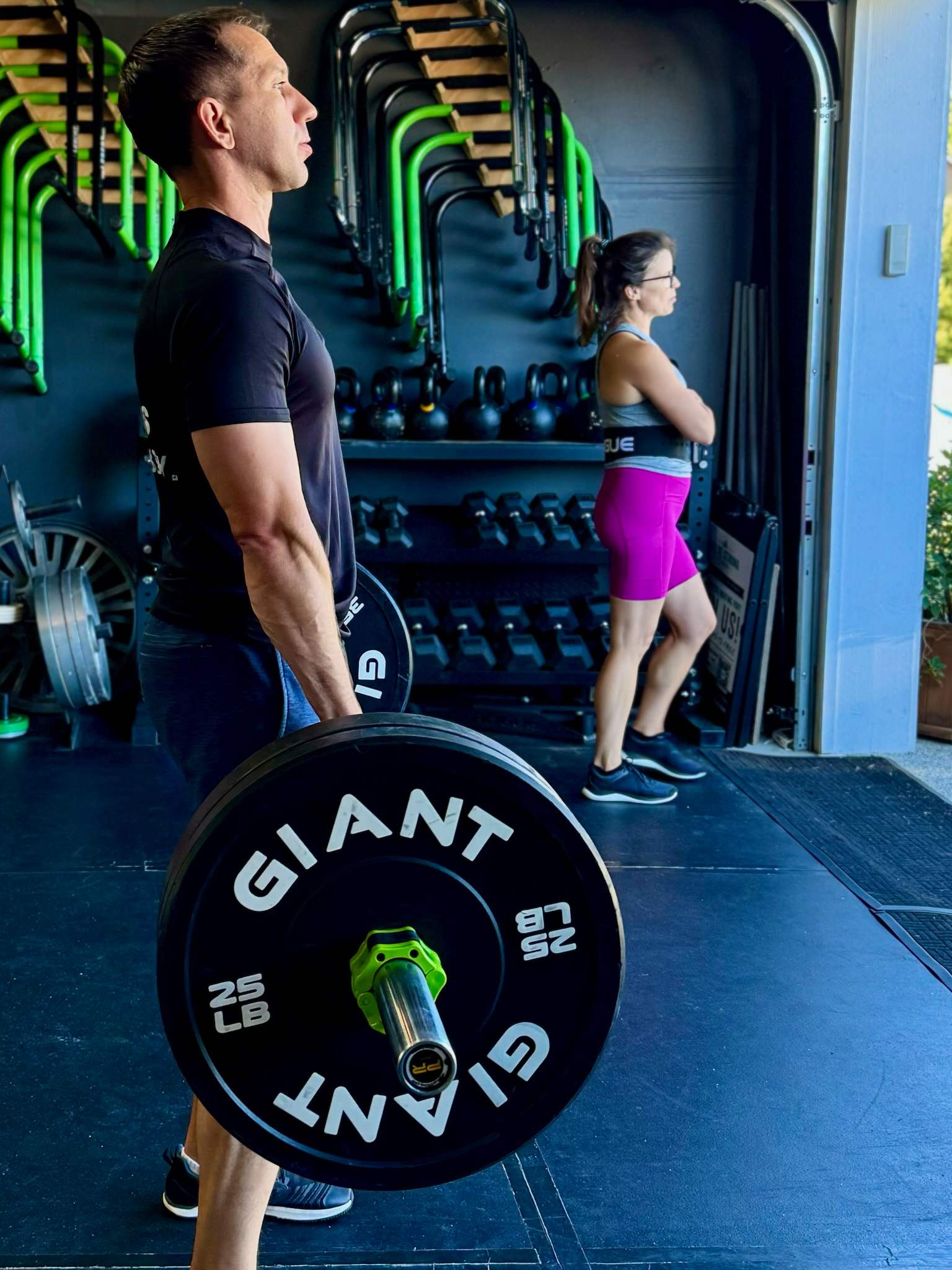 Outdoor fitness class with dumbbells, slam ball, kettlebell