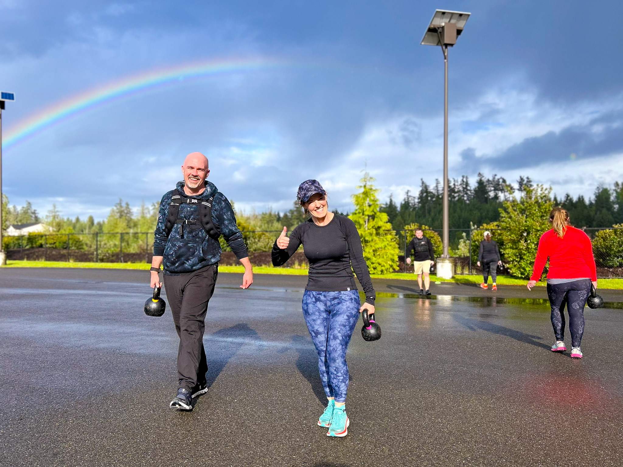 Outdoor fitness class with dumbbells